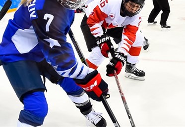 GANGNEUNG, SOUTH KOREA - FEBRUARY 22: USA's Monique Lamoureux-Morando #7 stickhandles the puck with Canada's Emily Clark #26 chasing during gold medal round action at the PyeongChang 2018 Olympic Winter Games. (Photo by Matt Zambonin/HHOF-IIHF Images)

